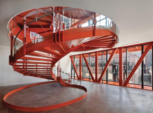 Starting on the second floor, a spiral staircase anchors the west end of the building, and serves as the primary circulation route.
