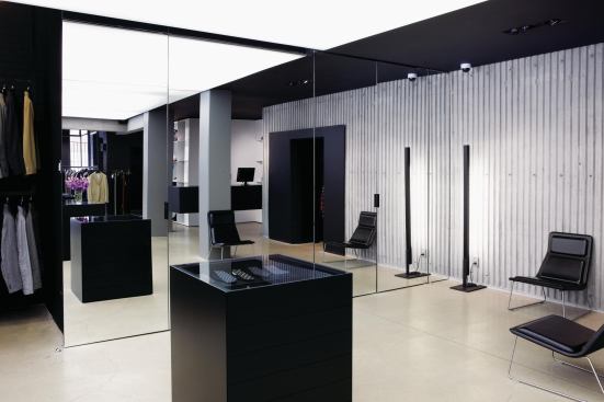 The smoked glass walls give way to conventional mirrors outside the changing rooms.