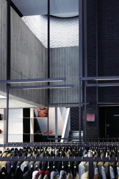 Hanging clothes racks looking toward oculus.