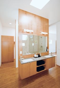 Other materials, including bamboo floors and birch cabinets, mimic the kitchen palette.