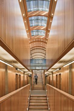 A central staircase and lightwell allow light from the third floor skylights to reach the office corridors on the third floor. Natural light is maximized and supplemented by energy-efficient fixtures such as Gammalux downlights and occupancy and light level sensors by Sensor Switch.Downlights

Gammalux Systems



GR4B-132T8 interior downlight

gammalux.comWall Finishes

Legere Woodworking



100 percent FSC-certified wall paneling

legeregroup.com