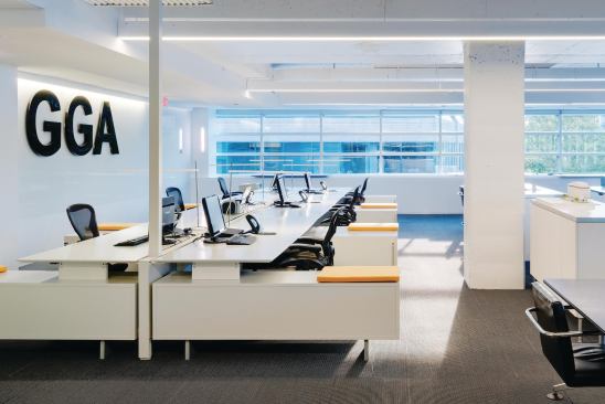 Much of the systems furniture was repurposed from the firm's previous space. Cleaned up and reoriented, the workstations sit in an area with daylight pouring in through the windows; high-efficiency light fixtures on sensors reduce unnecessary electricity usage.

Task Lighitng

Artemide



Talak fixture

artemide.usLighting

Osram Sylvania



Low-mercury fluorescent bulbs

sylvania.comFurniture System

Teknion



District desking system

teknion.comUpholstery Fabric

KnollTextiles



Ricochet textile in Topaz

knolltextiles.com