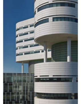 Exterior, with view of connecting volume to existing facility.