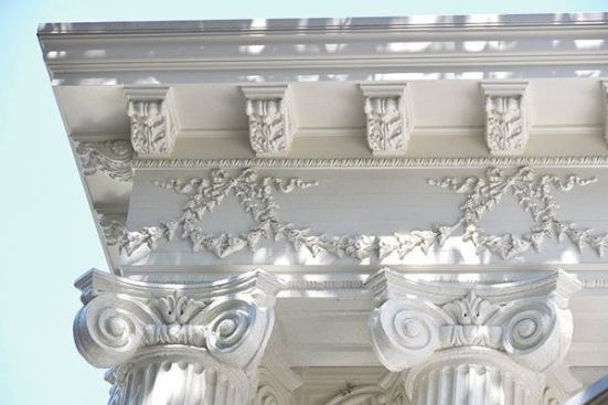 One obstacle was removing old plaster pieces, which were held together by lead paint and crumbled when touched. Mozen commissioned knives to be made to reproduce the mouldings; they used resins to create the pieces. So much structural damage existed on the columns, capitals, and entablature that they had to be locked together with 2x4s to secure them during the repair work.