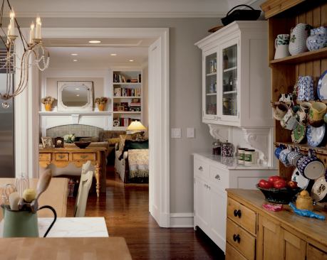 White built-in cabinets pay homage to, but don't overshadow, the homeowner's prized pine hutch.