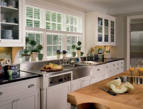 A change in countertop depth around the double sink is indicated by carved legs on either side.