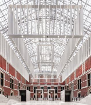 The western courtyard has four portals at the far end that echo the geometry of the chandelier.