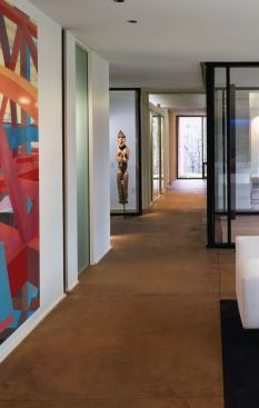 A piece of sculpture is framed by the indented entry hall.
