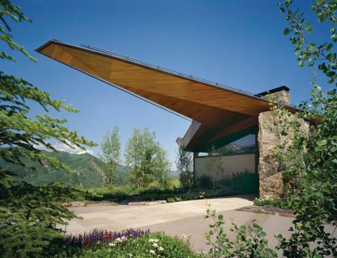 Generous glazing preserves views of the surrounding mountains.
