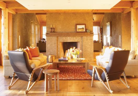 The durable zinc roof satisfies the local requirement for a nonreflective material, and thick pisé walls, ceiling fans, and operable windows supply natural air conditioning.