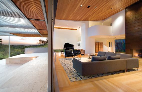 A reinvention of this '80s house turned the dining room into a gracious vestibule and the enlarged living room and terrace into a showcase for the pool and distant views.