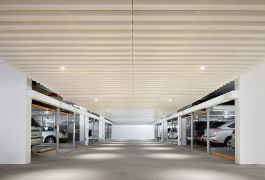 In the building's garage, general lighting is supplied by integrated LED MR16 lamps.