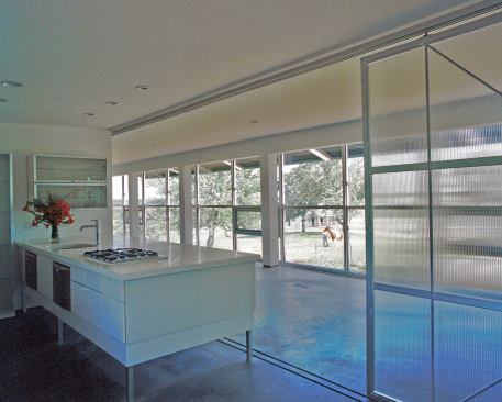 A radiant in-floor heating system picks up the slack on cloudy days.