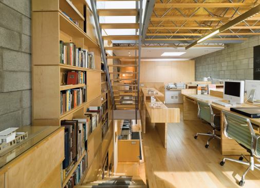 Materials also were chosen for their low-impact practicality. For desks, plan racks, a printer shelf, and a model display table, Damiani used maple butcher block “with a thickness that could cantilever, so pieces fly into the space.”