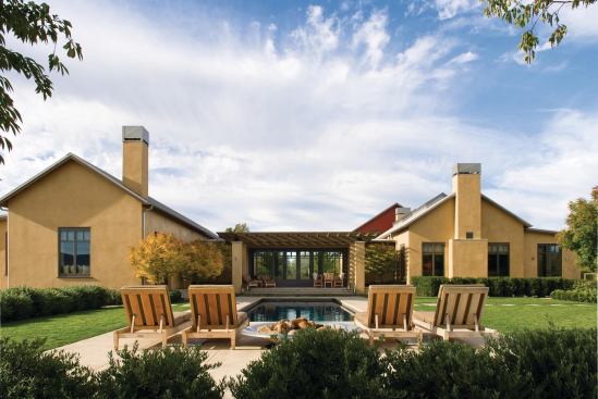 A product of JMAs long-standing relationship with architect Howard Backen, this Napa, Calif., residence bears the hallmarks of Backens California farmhouse style, reflected here in the buildings simple volumes, metal roofs, and exposed timber trusses. 

