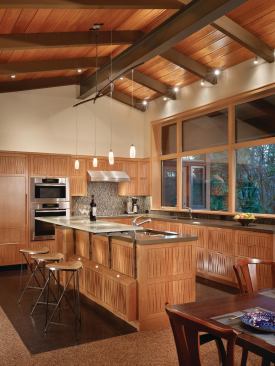 Many components of this kitchen were custom-fabricated, such as the resin and CNC-milled cabinets; cast-glass bar counter; hand-blown glass light fixtures; and steel wall panels, which were left outside to weather for three months. 

