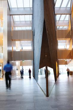 The central atrium is topped by glass outfitted with thin-film photovoltaics.