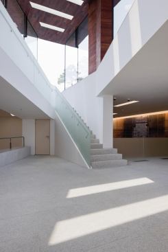 A ramp and stair lead to the gallery level downstairs. 