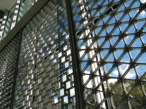 Because the system's panels are not yet weathertight, those installed at Stony Brook were placed behind the Simon Center's glass curtainwwall.