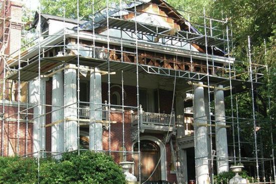 The home’s exterior was in a massive state of disrepair with serious structural damage: wood rot, lack of structural support in many places, brick work that needed tuck-pointing.