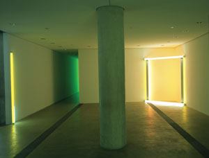 Flavin's work engages with its surroundings, each piece positioned to specifically address the architecture while simultaneously breaking the conventions of formal art display. 