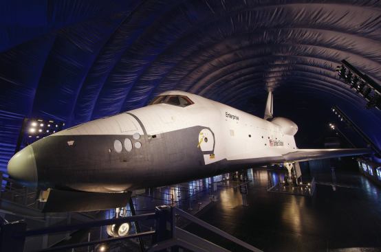 Inspired by an image of the space craft illuminated in white light against a fading blue sky, Focus Lighting convinced the client that this “twilight” backdrop would create the right atmospheric setting for this extraordinary piece of equipment. 