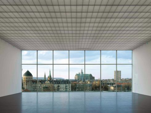 Each gallery terminates in a dramatic picture window that frames important local monuments: One is pointed at Metz's 13th century Gothic cathedral.