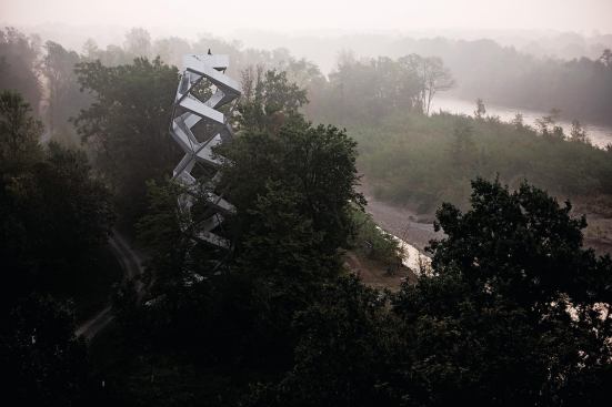 The seemingly complex design of the Mur Nature Observation Tower sits lightly on the Austrian landscape.