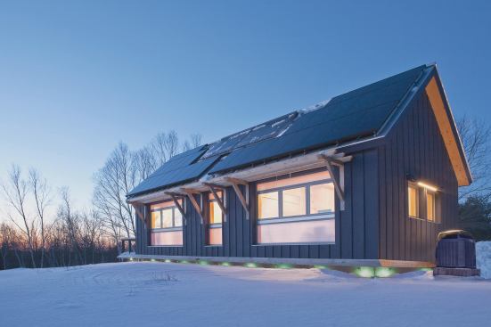This cutting-edge LEED-Platinum prototype production home is packed with high-performance features and flexible design details that minimize energy use and maximize livability. The house is designed for shop assembly, pre-built in a factory setting, and shipped to its site for quick completion. An LED light skirt on the exterior perimeter glows green when the house is a net-producer and red when its using grid power