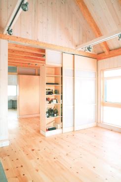 Flooring, walls, and trim were crafted with locally milled Eastern white pine. 