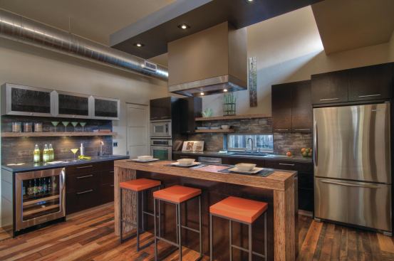 Reclaimed wood floors and FSC-certified cabinets add a natural touch to the contemporary kitchen. 