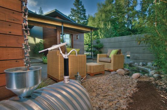 A rain chain drains water from the gutters into a 1,000-gallon cistern to be used for watering plants and for the backyard pond.
