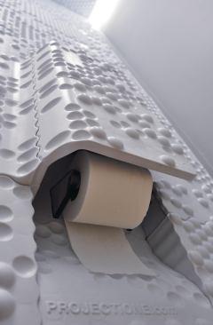 Panels were formed to accommodate an accessory console that holds everything from toilet paper to a cell phone as well as the designers' signature.