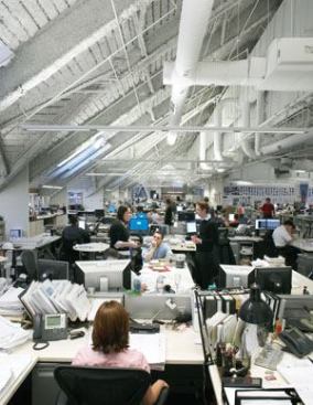 HOK's nontraditional office space in St. Louis features exposed ceilings and close working quarters without cubicles or partitions because those discouragecommunication among staff members.