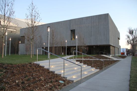 The museum, which houses a collection of approximately 2,400 artworks by American abstract expressionist painter Clyfford Still, sits just west of the Denver Art Museum’s Daniel Libeskind–designed addition. In contrast to its neighbor’s bold, steel-plated façade, the Clyfford Still Museum is a diminutive, two-story concrete structure.