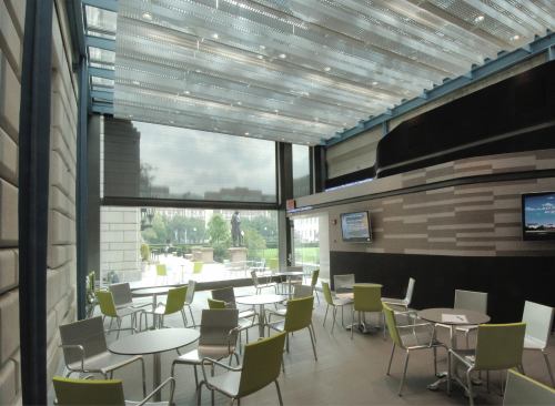 Café addition with operable glass wall open
