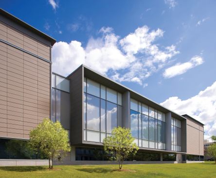 The south façade of the new addition is clad with a terra-cotta rainscreen and custom glass by Viracon. The finishes are designed to complement the materials in the original structure, while providing protection from harsh ultraviolet rays in three new galleries, a requirement for many traveling exhibitions.