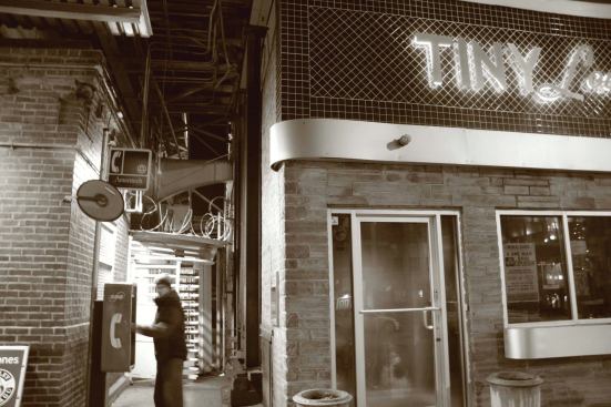 The original Tiny Lounge was an alternative to the neighborhood bar on Chicago’s North Side. With it’s brick façade and retro signage, the hot spot evoked a Rat Pack feel while offering both perfectly mixed cocktails and an after-work alternative for the people in the area.