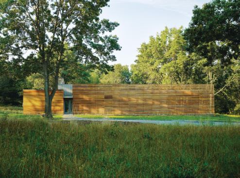 A red cedar screen shields the entry elevation.


