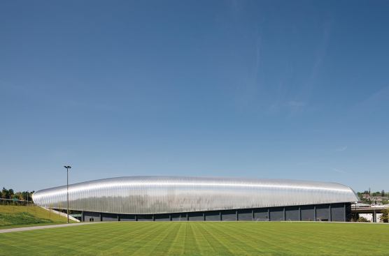 The roof of the 165,000-square-foot museum shelters the building's concrete structure, which includes four tiers of polished-concrete ramps, and spans a roughly 1-acre (400-by-110-foot) footprint.