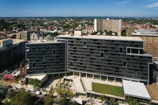 Erdy McHenry Architecture’s Radian Apartments project occupies land owned by Penn, but looks neither like a university development nor like other West Philadelphia mixed-use developments.