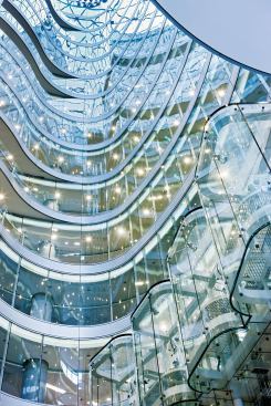 Air enters the building through doors in the lobby, the café, and louvers in the ground-floor curtainwall, and flows up through and is vented up and out the top of the central atrium to naturally ventilate the public spaces.
