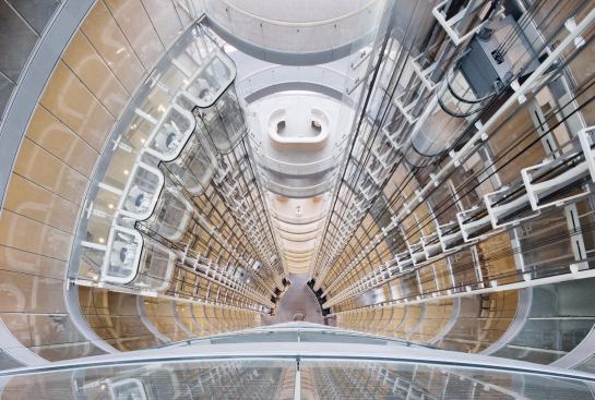 Atrium view down to lobby with view of glass elevators.