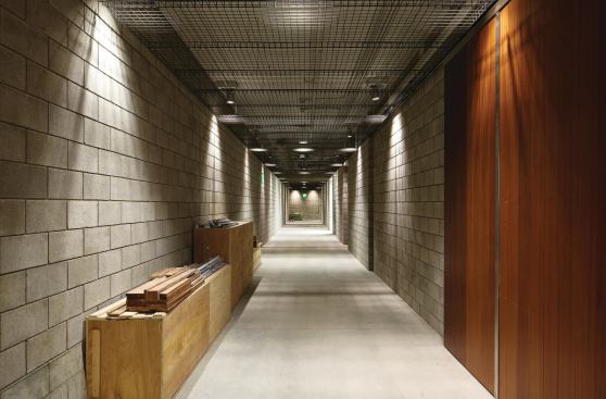 Located at the rear of the complex, the system stretches through sub-basement corridors, up into the display areas, and across 

to the library.