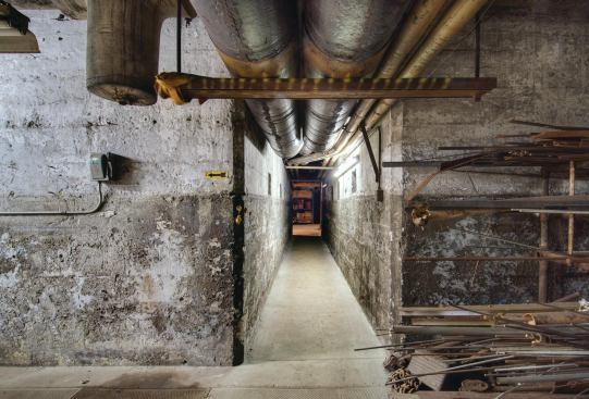 The once-daunting maze of narrow hallways and conduits in the basement has been transformed into a brightly painted and welcoming space. 