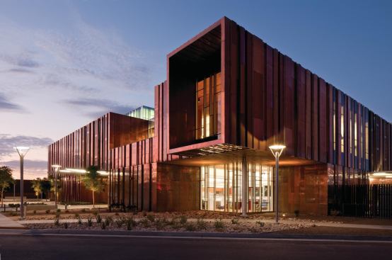 The copper rainscreen incorporates downspouts to manage water runoff, and it conceals the structure that supports the building’s lateral loads.