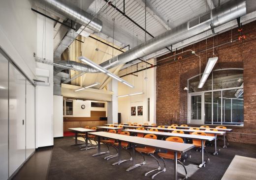 To preserve the building’s history, some of the historic elements were left in place (like the now-painted coal hopper). “We wanted the building to be an educational tool,” Homan Square Community Center Foundation president Kristin Dean says, “and to tell a story about energy production; how we used to produce energy 100 years ago, and how we produce it now.” The brick-clad coal chute was restored, and windows were installed so that students can look into the space from their new learning environment.