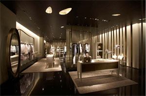 Lighting elements are used to modulate the space and showcase the clothing and accessories of the Giorgio Armani line. Speirs and Major Associates carried the bamboo leaf motif a step further by creating custom ceiling openings to house a fluorescent covelight, while a concealed slot system in the ceiling and over the clothes rails uses CDMR111 lamps. 
