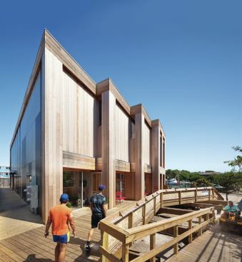 The western end of the building is anchored by three retail venues that open out onto the board-lined walkways of the Pines.