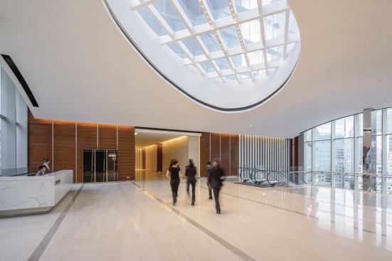 A sky lobby has dedicated elevators that access the office levels in the tower above.